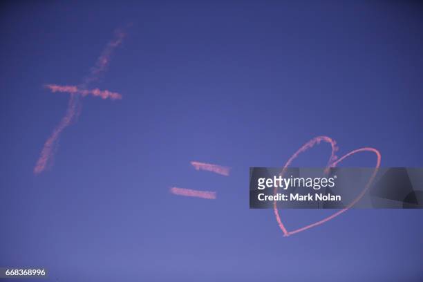 Writing is pictured in the sky during the round seven NRL match between the Canterbury Bulldogs and the South Sydney Rabbitohs at ANZ Stadium on...
