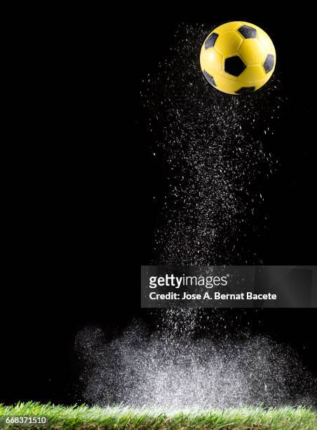 particles of powder for the impact ball of football in the lawn  of a soccer field - césped stock-fotos und bilder