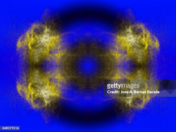 explosion of water drops of  colors gray and golden, floating in the air  on a blue background - crecimiento stock-fotos und bilder