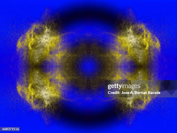 explosion of water drops of  colors gray and golden, floating in the air  on a blue background - partícula stock pictures, royalty-free photos & images