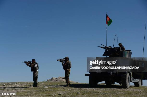 Afghan security forces take part in an ongoing operation against Islamic State militants in the Achin district of Afghanistan's Nangarhar province on...