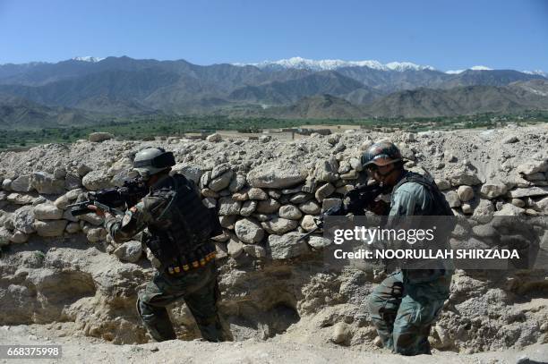 Afghan security forces take part in an ongoing operation against Islamic State militants in the Achin district of Afghanistan's Nangarhar province on...