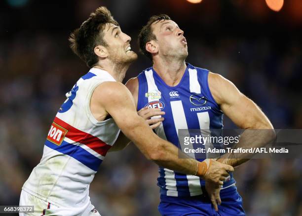 Tom Campbell of the Bulldogs and Todd Goldstein of the Kangaroos compete in a ruck contest during the 2017 AFL round 04 match between the North...