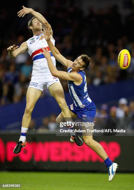 Robert Murphy of the Bulldogs gives away a free kick to Kayne Turner of the Kangaroos during the 2017 AFL round 04 match between the North Melbourne...