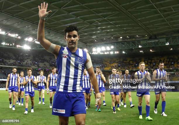 Lindsay Thomas of the Kangaroos salutes the crowd after his 200th match during the 2017 AFL round 04 match between the North Melbourne Kangaroos and...