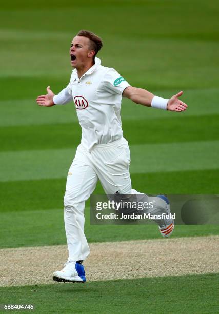 Tom Curran of Surrey celebrates bowling out Luke Procter of Lancashire during day one of the Specsavers County Championship Division One match...