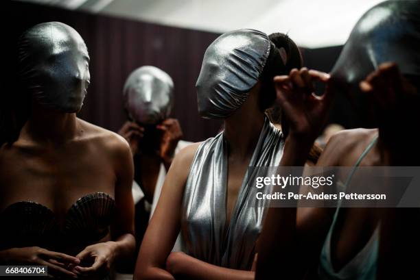 Models walking for the designer Habits waits backstage before a show on July 30 2015 at the V&A Watershed in Cape Town, South Africa. Habits is one...