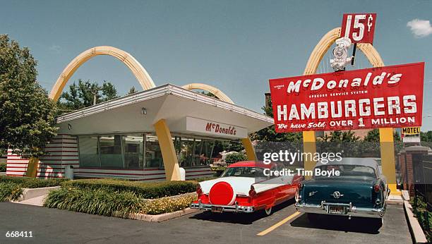 Ford, left, and a 1955 Oldsmobile are parked in the lot of the McDonald's museum July 14, 2000 in Des Plaines, IL. On this site April 15, 1955 Ray...