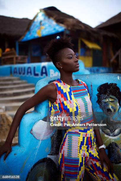 Model wears a creation by the Ghanaian/American designers Osei-Duro on April 21, 2015 at a beach club in Accra, Ghana.