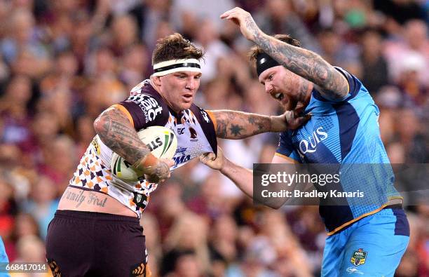 Josh McGuire of the Broncos attempts to break away from the defence during the round seven NRL match between the Brisbane Broncos and the Gold Coast...