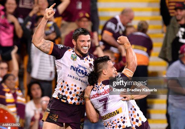 James Roberts of the Broncos is congratulated by team mates after scoring the match winning try during the round seven NRL match between the Brisbane...