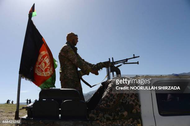 Afghan security force personnel take part in an ongoing operation against an Islamic State militant stronghold in Achin district of Nangarhar,...