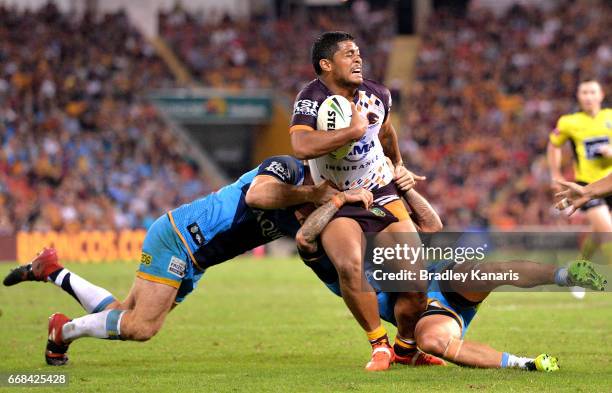 Anthony Milford of the Broncos attempts to break through the defence during the round seven NRL match between the Brisbane Broncos and the Gold Coast...