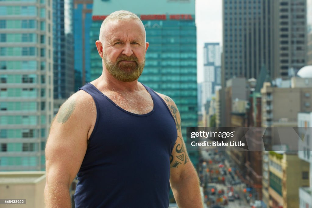 Man on roof above city