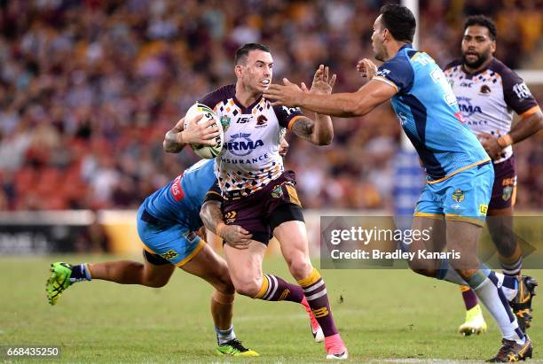 Darius Boyd of the Broncos attempts to break through the defence during the round seven NRL match between the Brisbane Broncos and the Gold Coast...