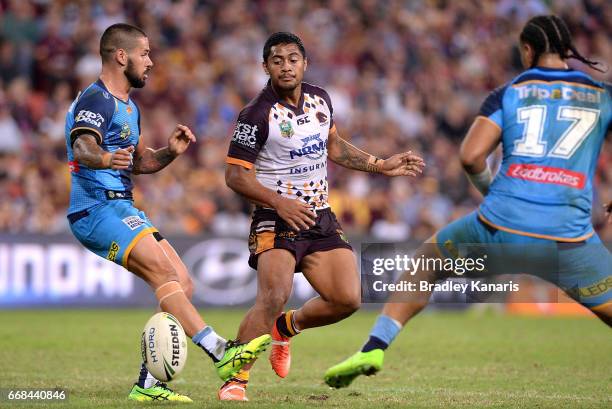 Anthony Milford of the Broncos gets a kick away during the round seven NRL match between the Brisbane Broncos and the Gold Coast Titans at Suncorp...