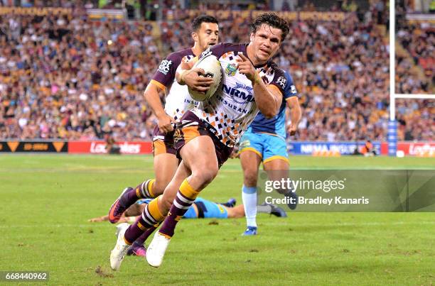 James Roberts of the Broncos celebrates scoring a try during the round seven NRL match between the Brisbane Broncos and the Gold Coast Titans at...