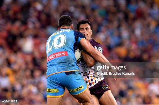 Herman Ese'Ese of the Broncos takes on the defence during the round seven NRL match between the Brisbane Broncos and the Gold Coast Titans at Suncorp...