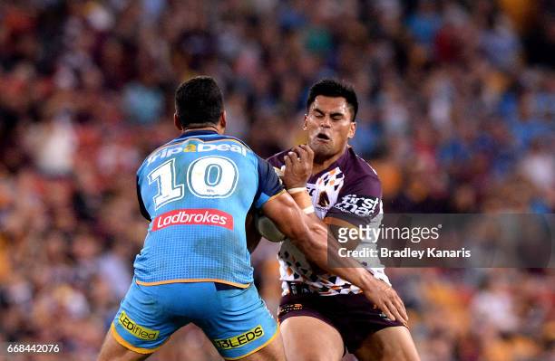 Herman Ese'Ese of the Broncos takes on the defence during the round seven NRL match between the Brisbane Broncos and the Gold Coast Titans at Suncorp...