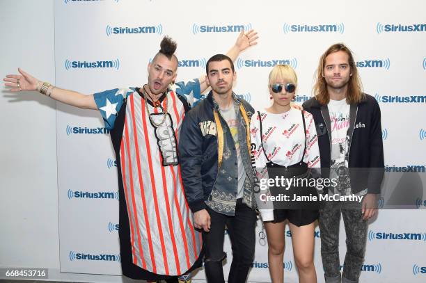 Cole Whittle, Joe Jonas, JinJoo Lee, and Jack Lawless of music group DNCE visit SiriusXM Studios on April 14, 2017 in New York City.