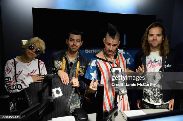 JinJoo Lee, Joe Jonas, Cole Whittle and Jack Lawless of music group DNCE visit SiriusXM Studios on April 14, 2017 in New York City.