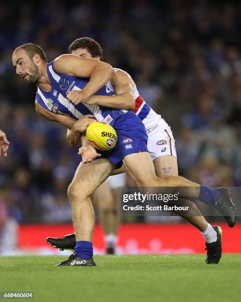 Ben Cunnington of the Kangaroos runs with the ball during the round four AFL match between the North Melbourne Kangaroos and the Western Bulldogs at...