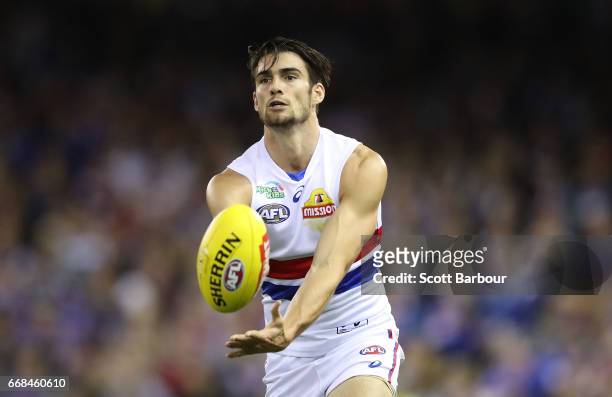 Easton Wood of the Bulldogs runs with the ball during the round four AFL match between the North Melbourne Kangaroos and the Western Bulldogs at...