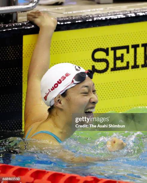 Satomi Suzuki celebrates winning the gold medal after competing in the Women's 50m final during day two of the Japan Swim at Nippon Gaishi Areana on...