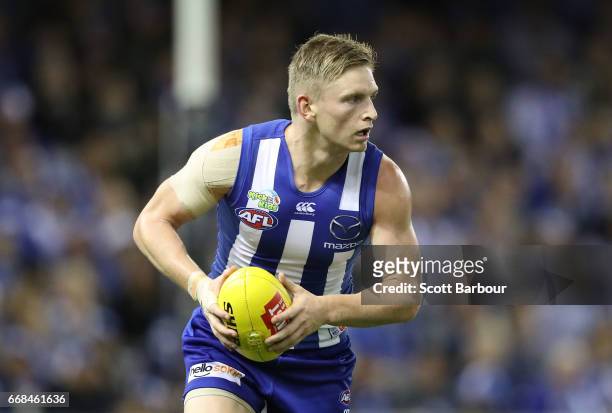 Jack Ziebell of the Kangaroos runs with the ball during the round four AFL match between the North Melbourne Kangaroos and the Western Bulldogs at...
