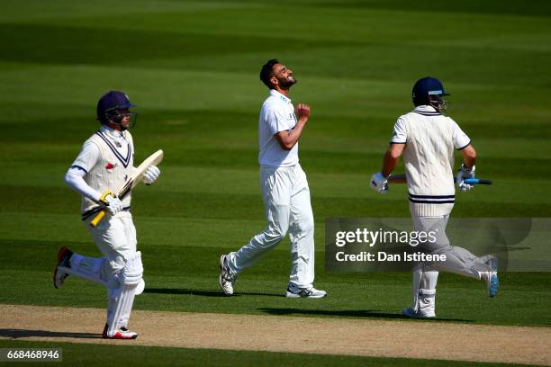 Ajmal Shahzad of Sussex reacts as Sean Dickson and Sam Northeast of Kent run a single during day one of the Specsavers County Championship Division...