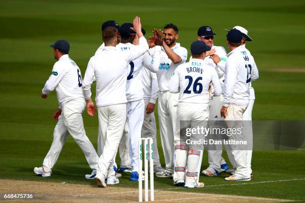 Ajmal Shahzad of Sussex celebrates with team-mates after claiming the wicket of Sam Northeast of Kent during day one of the Specsavers County...