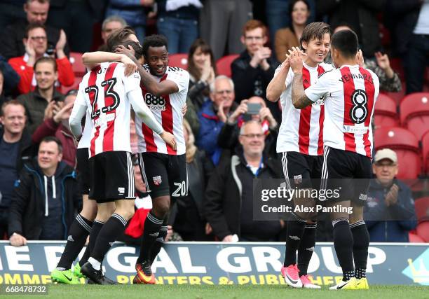 Lasse Vibe of Brentford celebrates with team mates after he scores his sides first goal during the Sky Bet Championship match between Brentford and...