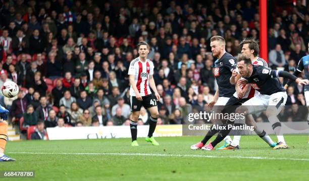 Lasse Vibe of Brentford scores his sides first goal during the Sky Bet Championship match between Brentford and Derby County at Griffin Park on April...