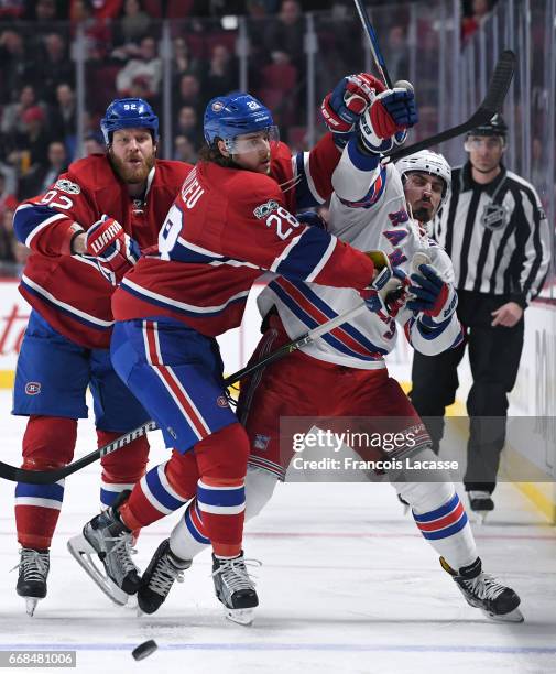 Nathan Beaulieu of the Montreal Canadiens checks Chris Kreider of the New York Rangers in Game One of the Eastern Conference Quarterfinals during the...