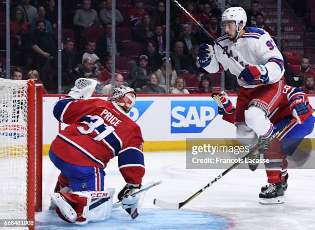 Carey Price of the Montreal Canadiens makes a glove save against Mika Zibanejad the New York Rangers in Game One of the Eastern Conference...