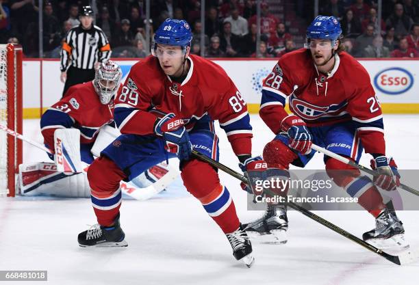 Carey Price, Nikita Nesterov and Nathan Beaulieu of the Montreal Canadiens defend the goal against the New York Rangers in Game One of the Eastern...