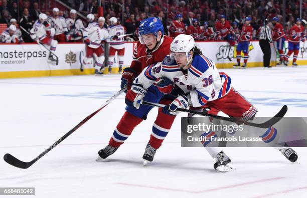 Artturi Lehkonen of the Montreal Canadiens skates against Mats Zuccarello of the New York Rangers in Game One of the Eastern Conference Quarterfinals...