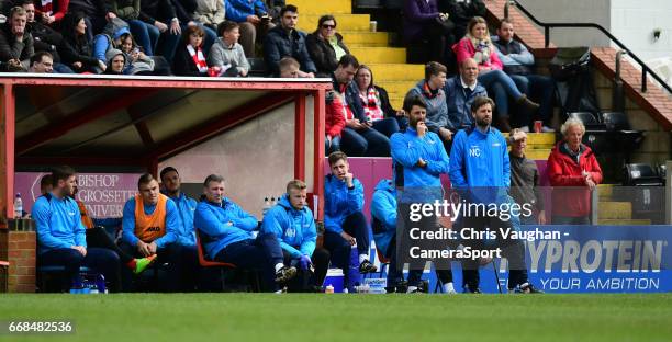 Lincoln City manager Danny Cowley, stood left, and Lincoln City's assistant manager Nicky Cowley, stood right, watch on from the dug out during the...