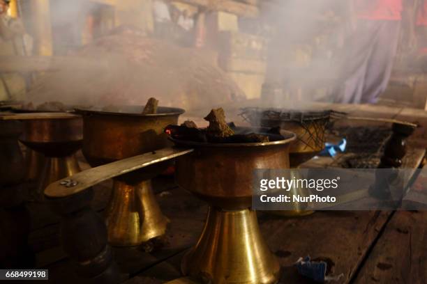 Hindu priests perform the Ganga Aarti ritual in Varanasi. Fire puja is a Hindu ritual that takes place at Dashashwamedh Ghat on the banks of the...