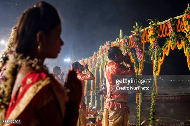 Hindu priests perform the Ganga Aarti ritual in Varanasi. Fire puja is a Hindu ritual that takes place at Dashashwamedh Ghat on the banks of the...