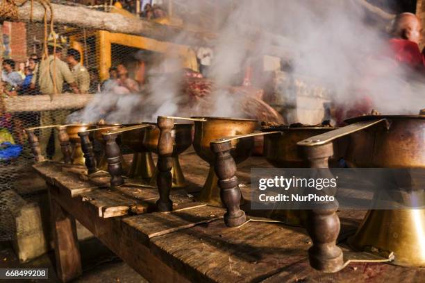 Hindu priests perform the Ganga Aarti ritual in Varanasi. Fire puja is a Hindu ritual that takes place at Dashashwamedh Ghat on the banks of the...