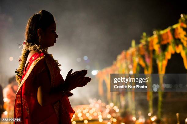 Hindu priests perform the Ganga Aarti ritual in Varanasi. Fire puja is a Hindu ritual that takes place at Dashashwamedh Ghat on the banks of the...