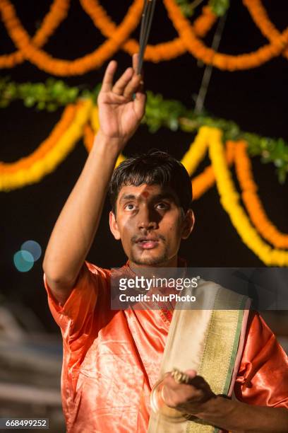 Hindu priests perform the Ganga Aarti ritual in Varanasi. Fire puja is a Hindu ritual that takes place at Dashashwamedh Ghat on the banks of the...