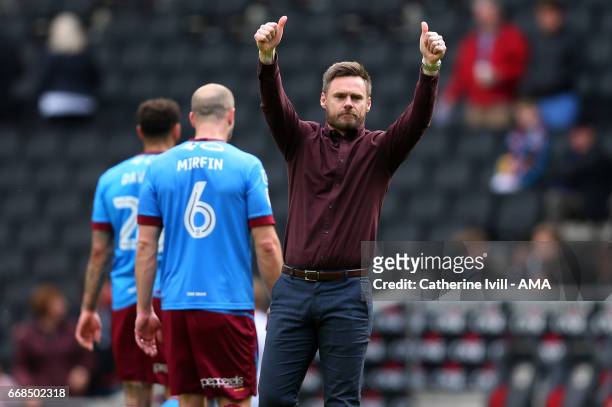 Thumbs up from Graham Alexander manager of Scunthorpe United after the Sky Bet League One match between MK Dons and Scunthorpe United at StadiumMK on...