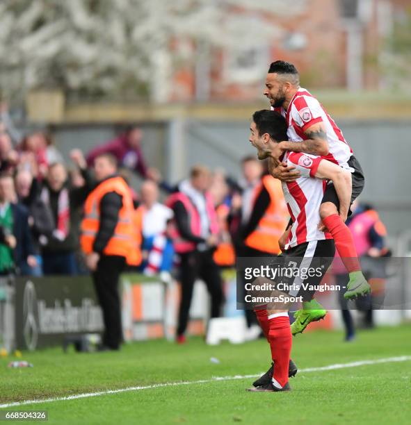 Lincoln City's Sam Habergham, left, celebrates scoring his sides second goal with team-mate Nathan Arnold during the Vanarama National League match...