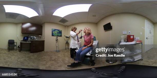 Madison Tolchin visits Paula Glass, an advanced registered nurse practitioner, for a health checkup at a Planned Parenthood clinic on April 14, 2017...