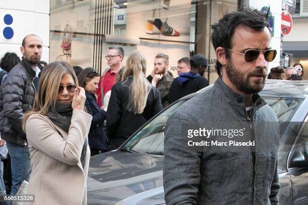 Jennifer Aniston and husband Justin Theroux are seen leaving the 'Colette' store on April 14, 2017 in Paris, France.