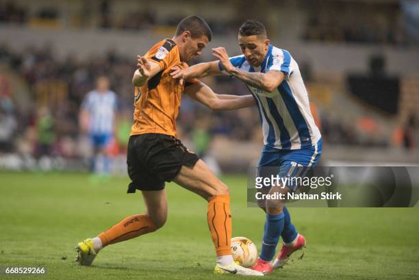 Anthony Knockaert of Brighton & Hove Albion and Conor Coady of Wolverhampton Wanderers in action during the Sky Bet Championship match between...