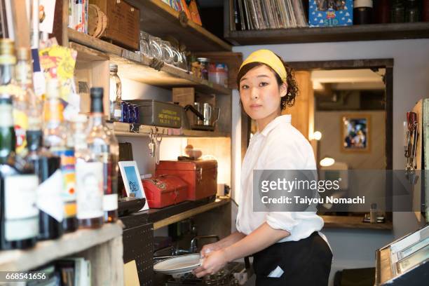 japanese women working at a cafe - カフェ bildbanksfoton och bilder