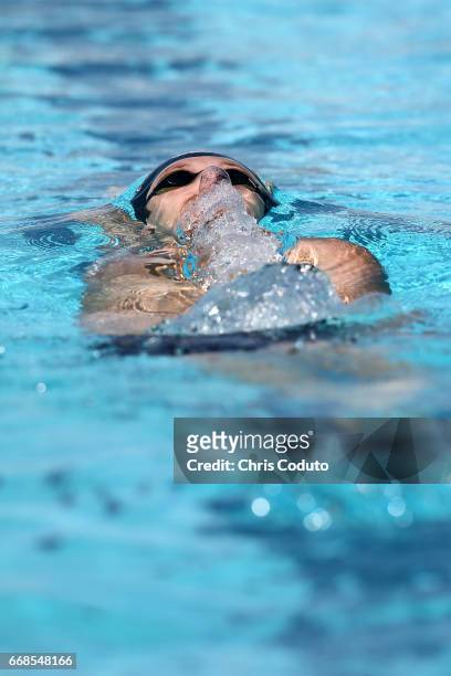 Henrique Rodrigues competes in the preliminary heat of the men's 200 meter backstroke on day two of the Arena Pro Swim Series - Mesa at Skyline...